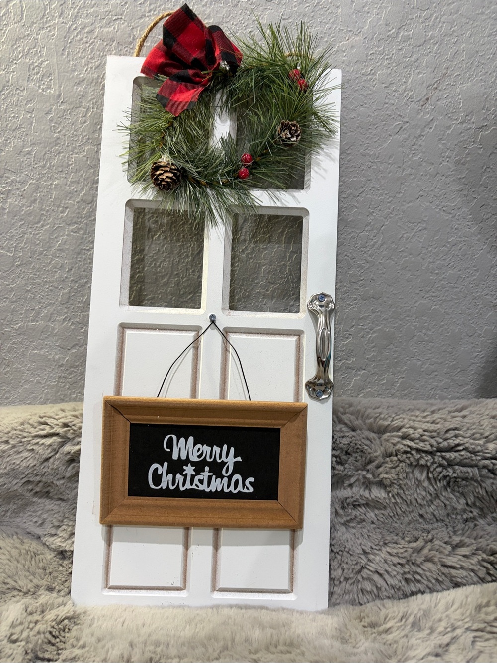 Festive White Holiday Door Decor with Green Pine Wreath and Buffalo Plaid Bow